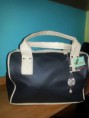 /products/cartera-baul-negro-y-beige/